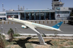 FILE PHOTO: Model of an Ariana Afghan Airlines airplane is seen in front of the international airport in Kabul